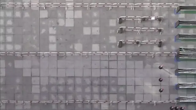 Influence of Pre-bottleneck Diversion Devices on Pedestrian Flow